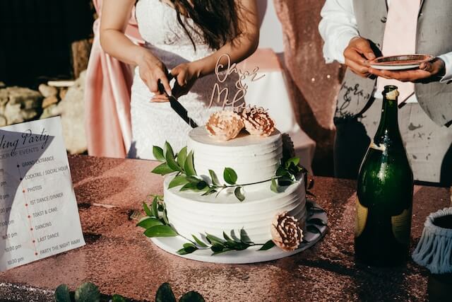 wedding cake being cut