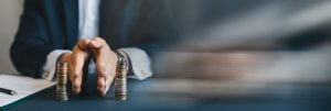 Businessman separates stack coins