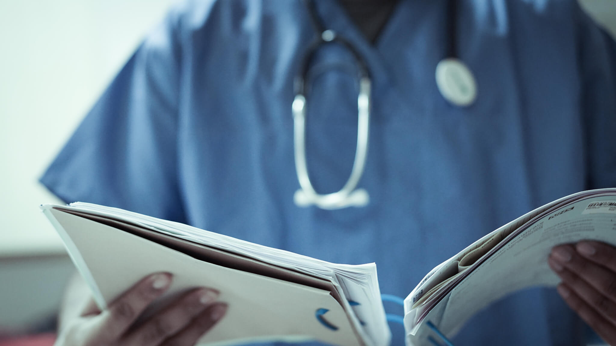 Doctor With Stethoscope And Files