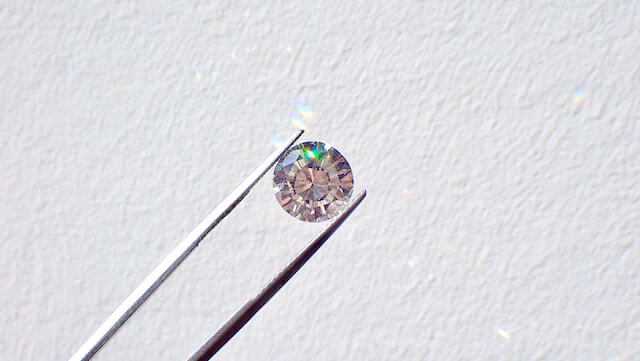 diamond held by tweezers