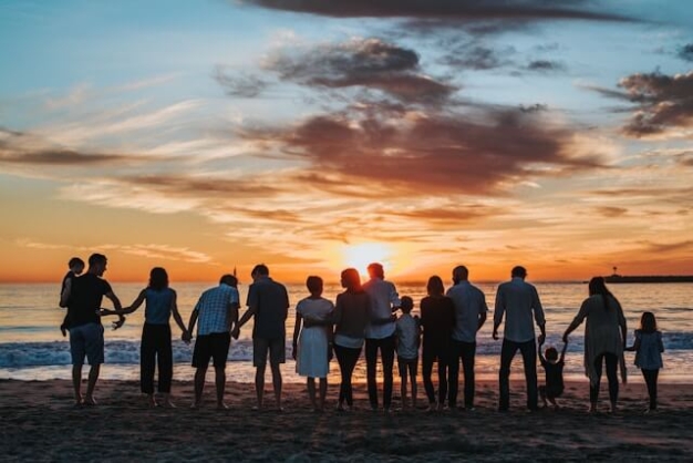 large family on the beach