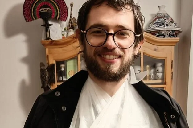 Greg Simmons with his arm in a sling after his cycling accident in Edmonton