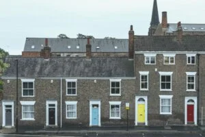 Row of terraced houses with brightly coloured front doors